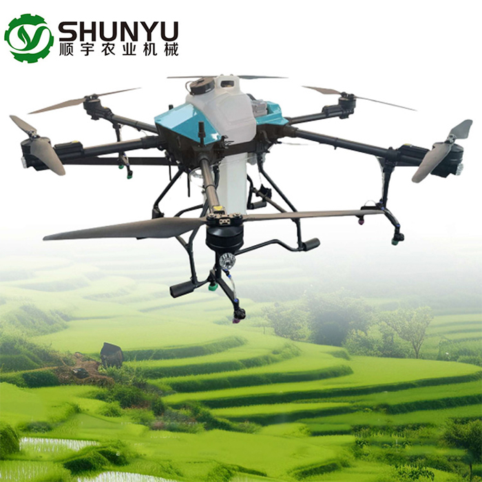 Agricultural spraying drone operating over farm field